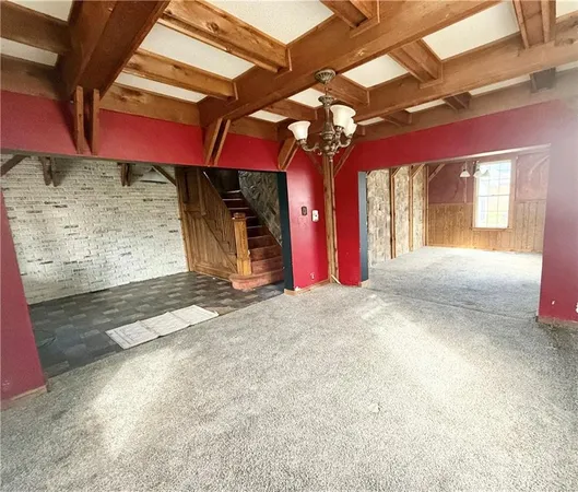 a view of a room with windows and chandelier