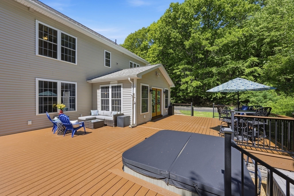 345 Bragg Road Warren, MA 01585 - Photo 34 of 41 a patio with wooden floors and furniture