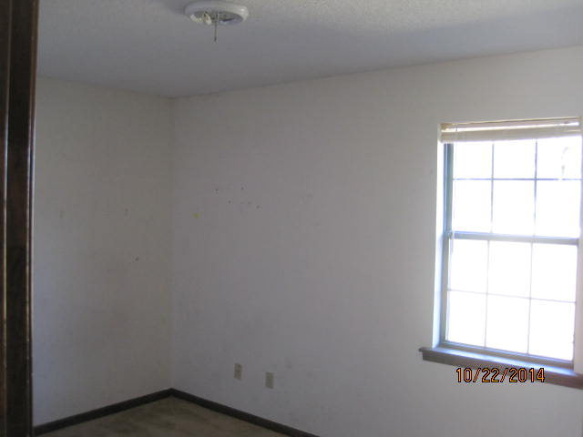 657 River Road Fort Valley, GA 31030 - Photo 12 of 13 an empty room with a window