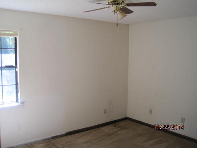 657 River Road Fort Valley, GA 31030 - Photo 13 of 13 an empty room with a window and a fan