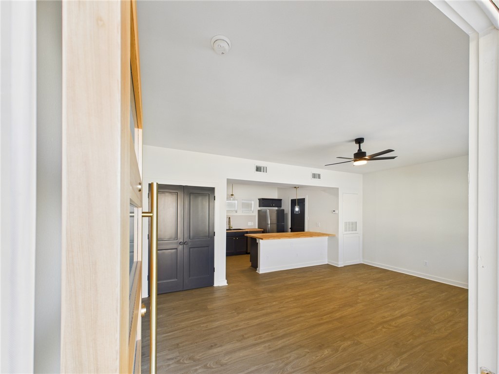 309 Mobile Avenue, Unit 4 Bryan, TX 77801 - Photo 3 of 12 a view of a kitchen with a sink and a refrigerator