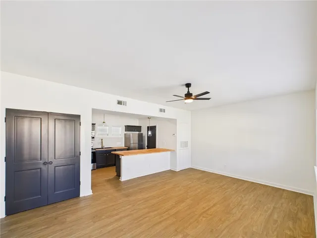 a view of a kitchen with a sink and cabinet