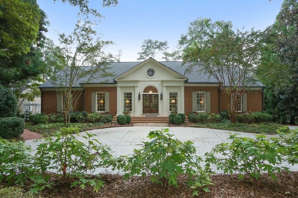 Stately curb appeal with professional landscaping.