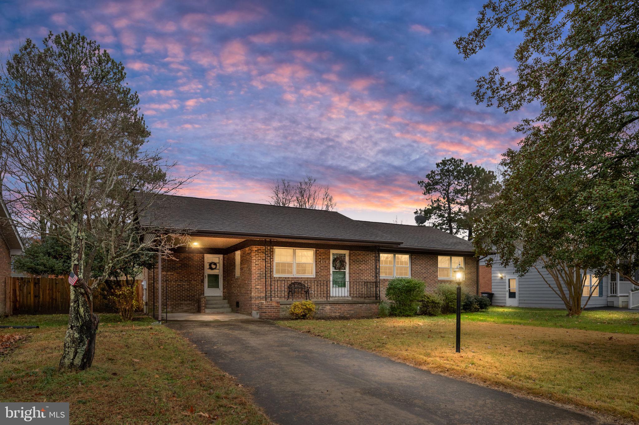 128 11th Street Colonial Beach, VA 22443 - Photo 1 of 80 a view of a house with a yard and tree s