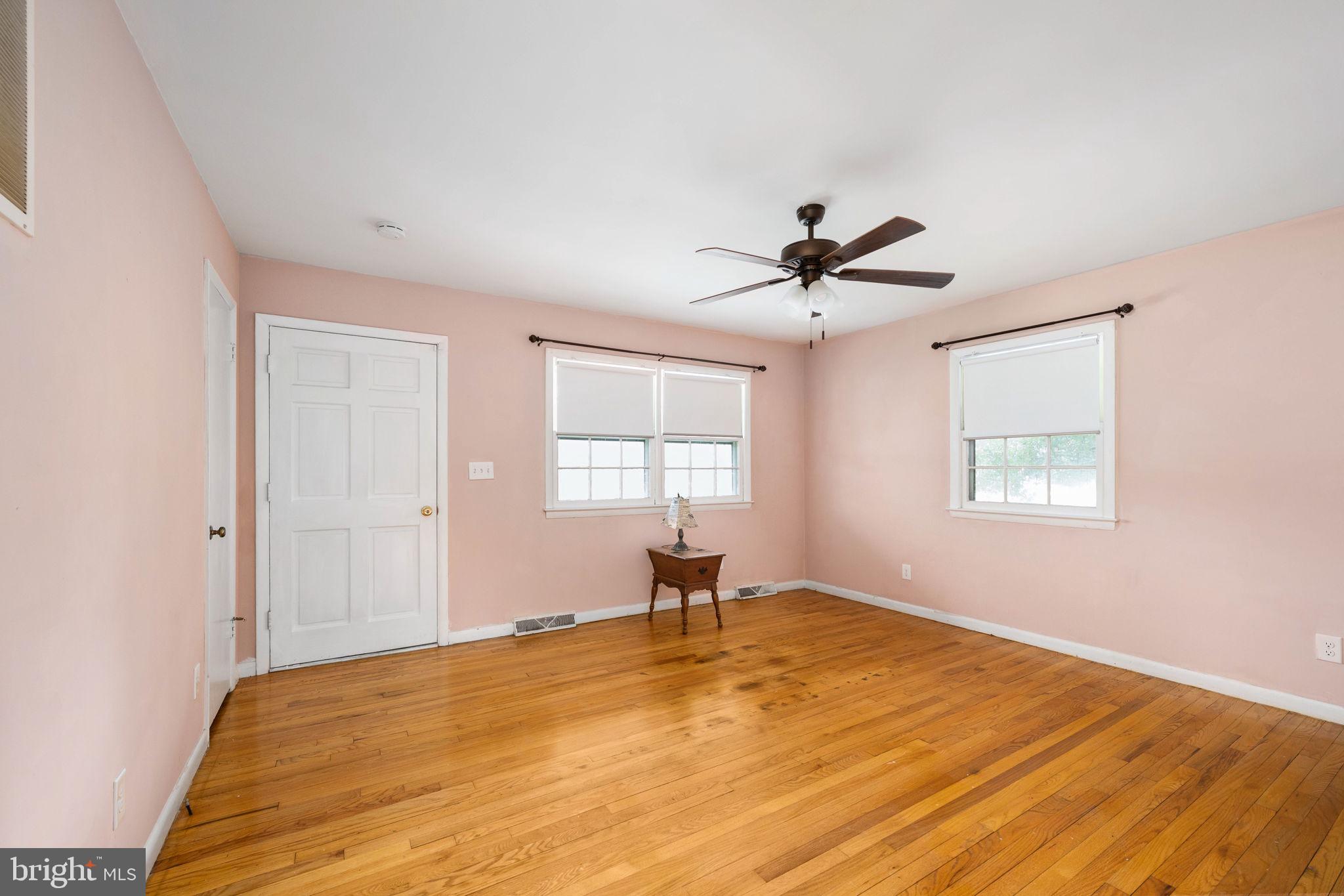 128 11th Street Colonial Beach, VA 22443 - Photo 12 of 58 a bedroom with a bed and a window