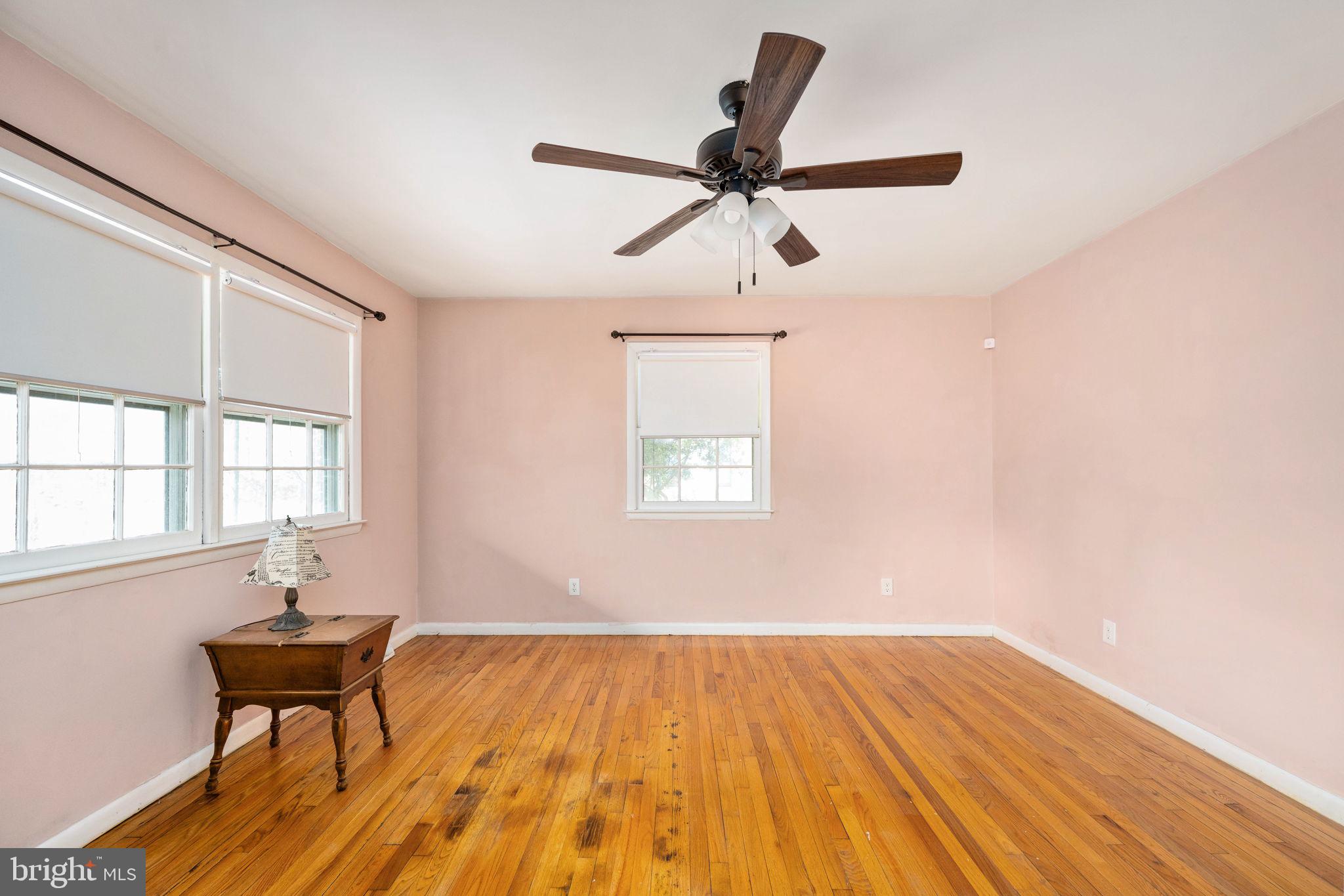 128 11th Street Colonial Beach, VA 22443 - Photo 15 of 80 a view of a livingroom with wooden floor and a window