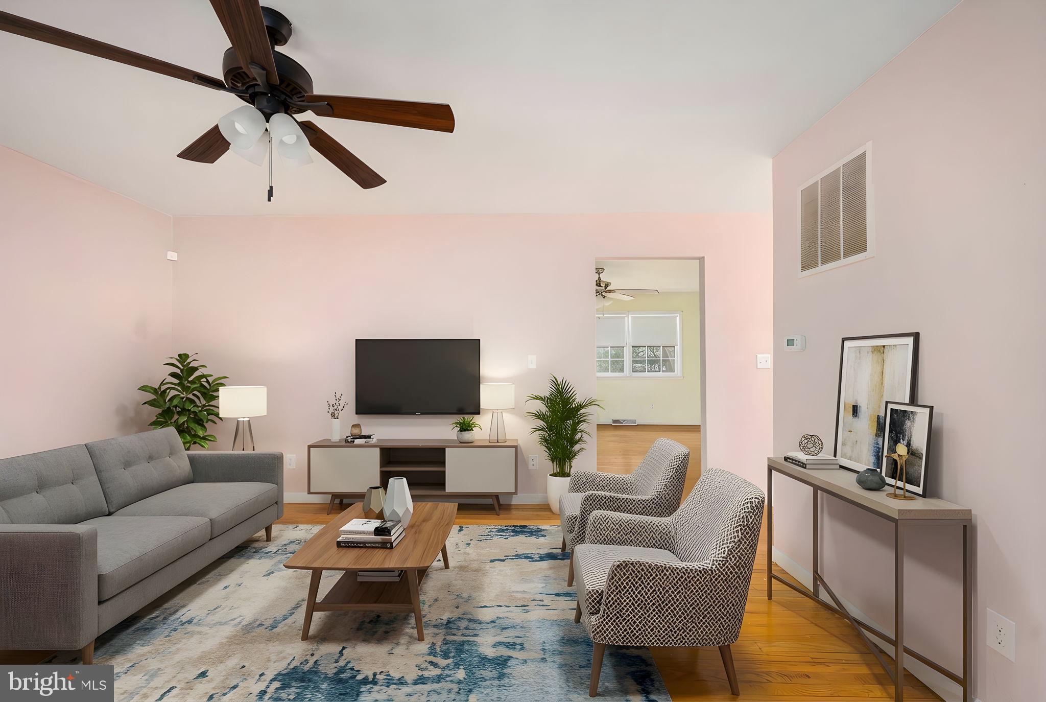 128 11th Street Colonial Beach, VA 22443 - Photo 21 of 80 a living room with furniture and a flat screen tv