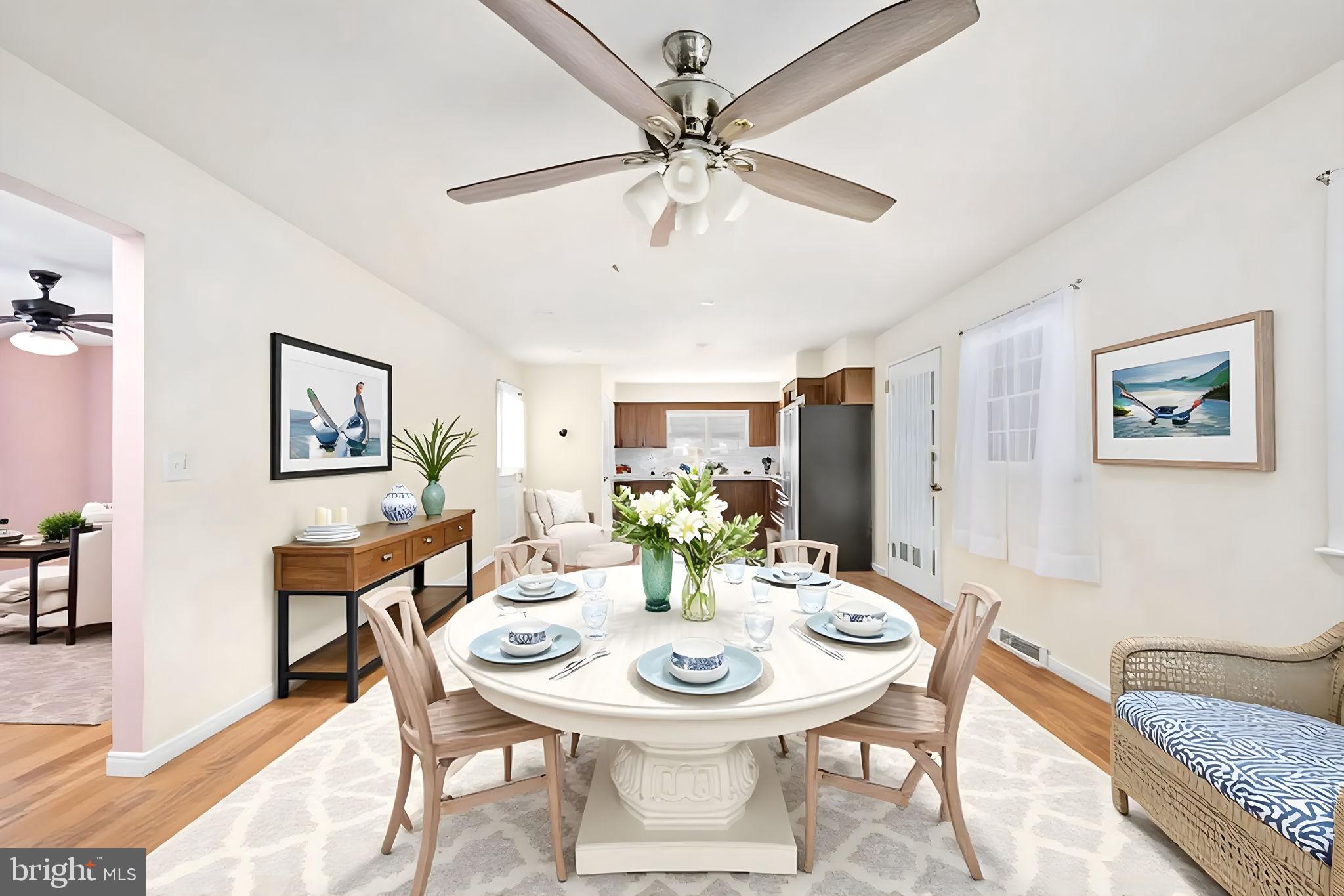 128 11th Street Colonial Beach, VA 22443 - Photo 25 of 80 a view of a dining room with furniture and a chandelier