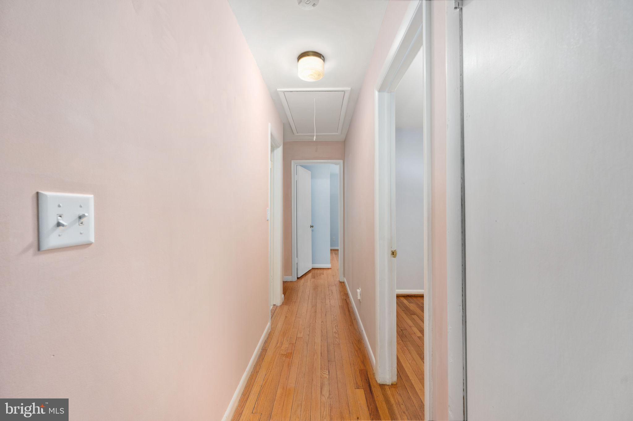 128 11th Street Colonial Beach, VA 22443 - Photo 27 of 58 a view of a hallway with wooden floor