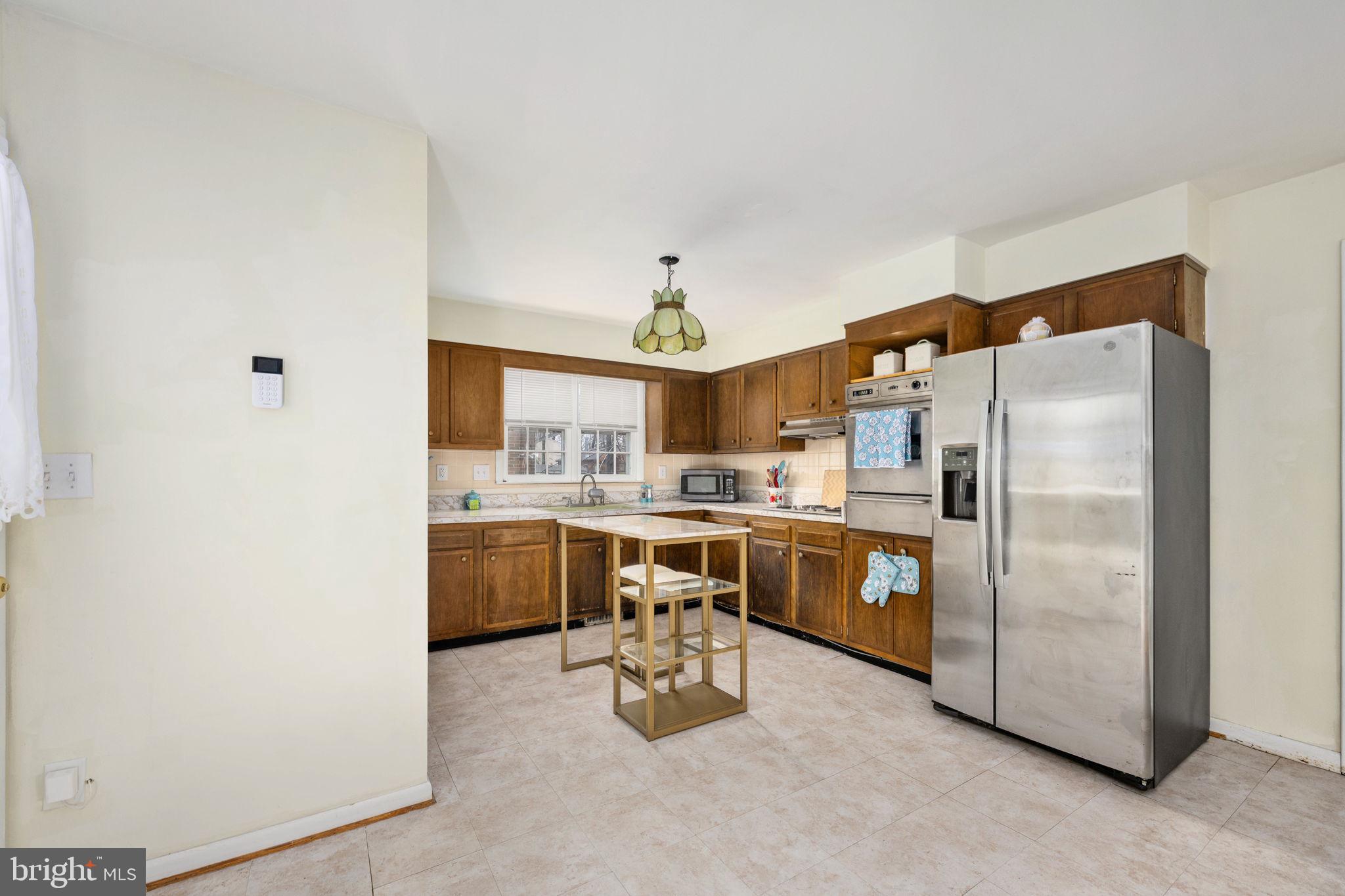 128 11th Street Colonial Beach, VA 22443 - Photo 28 of 80 a kitchen with counter top space and stainless steel appliances