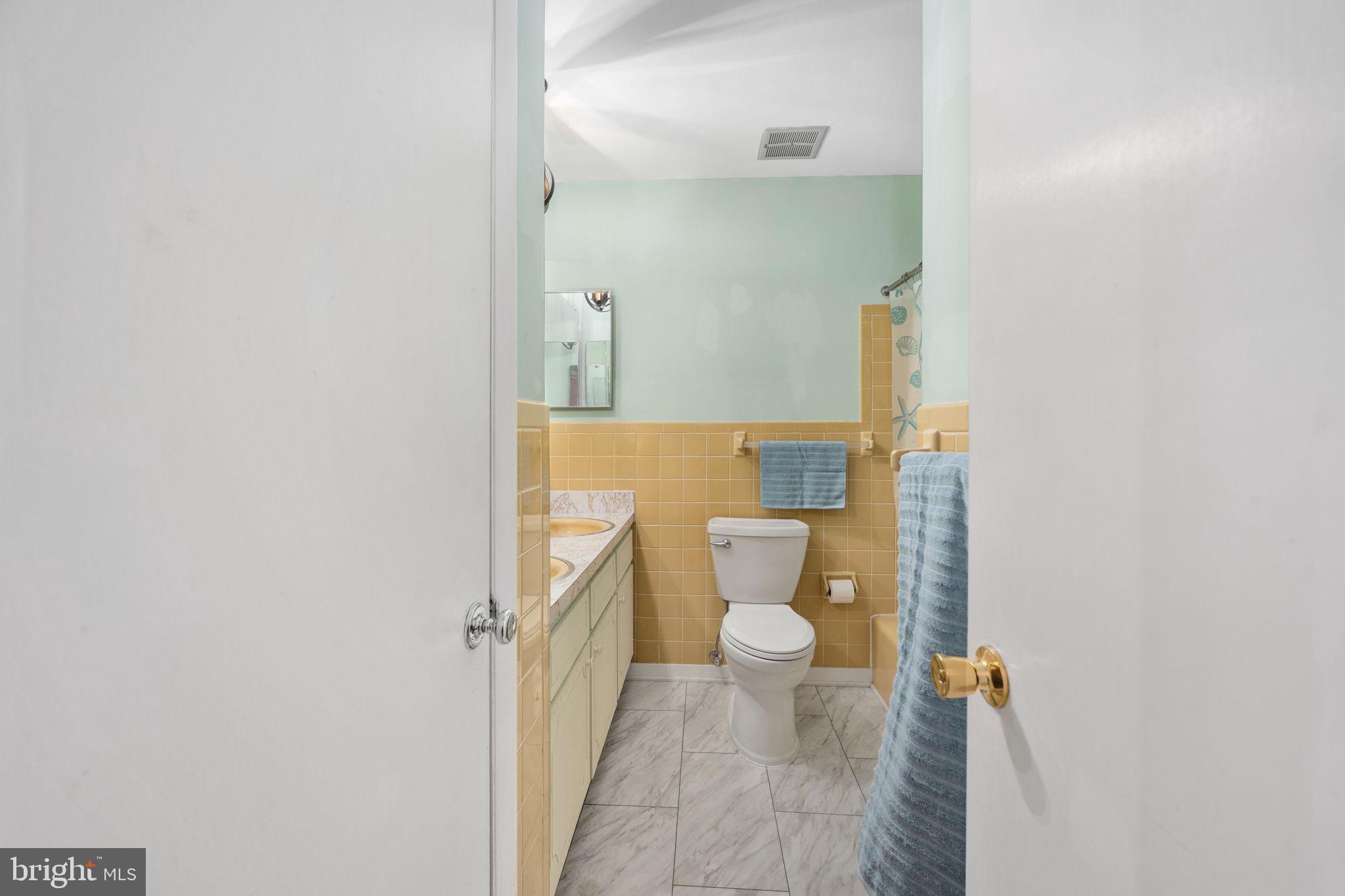 128 11th Street Colonial Beach, VA 22443 - Photo 30 of 58 a bathroom with a toilet and a shower