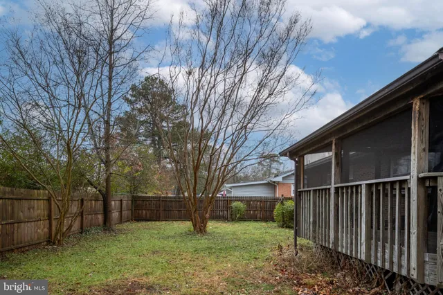 a view of a swimming pool with a bench and a couch