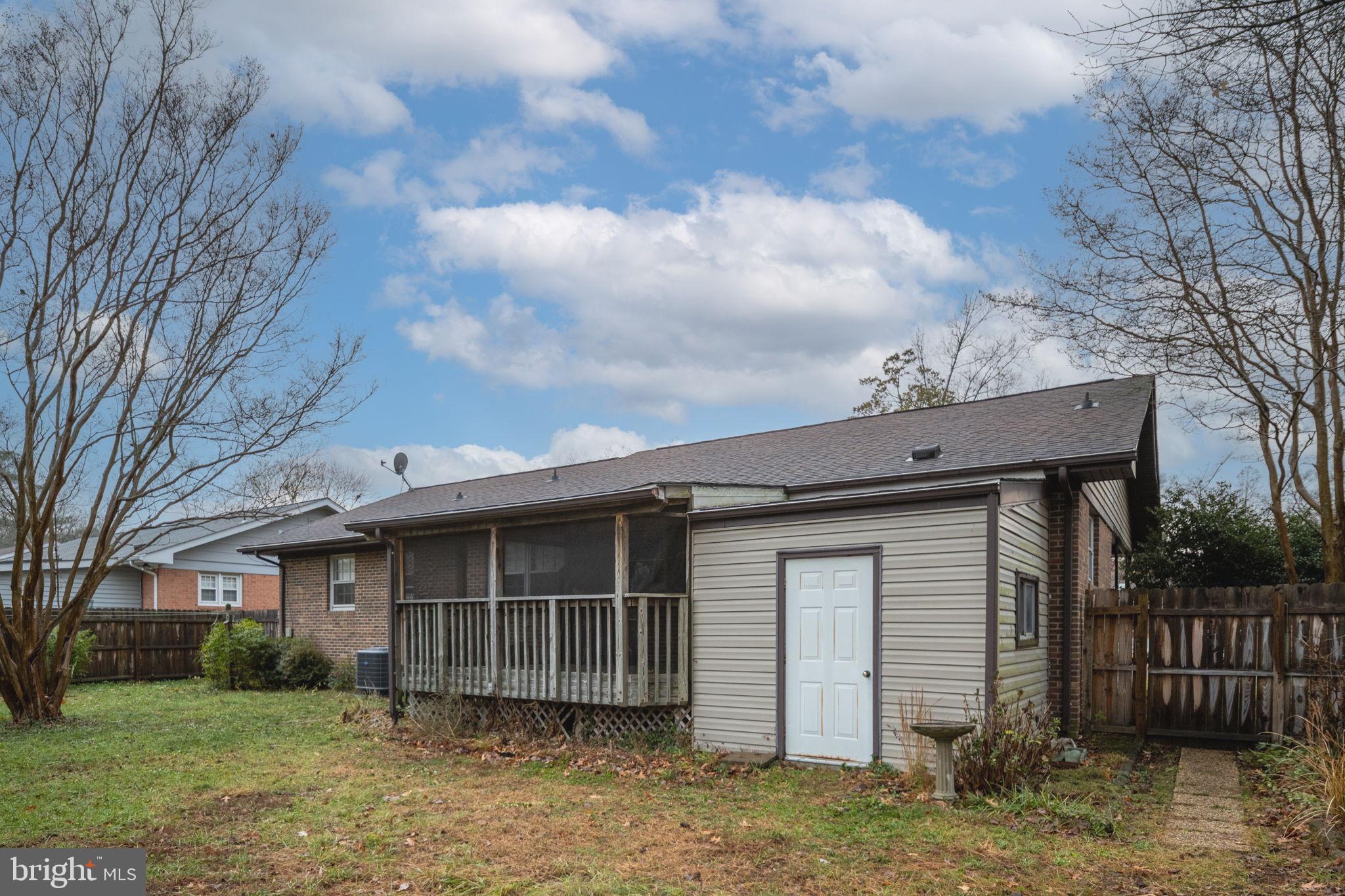 128 11th Street Colonial Beach, VA 22443 - Photo 46 of 58 front view of a house with a yard