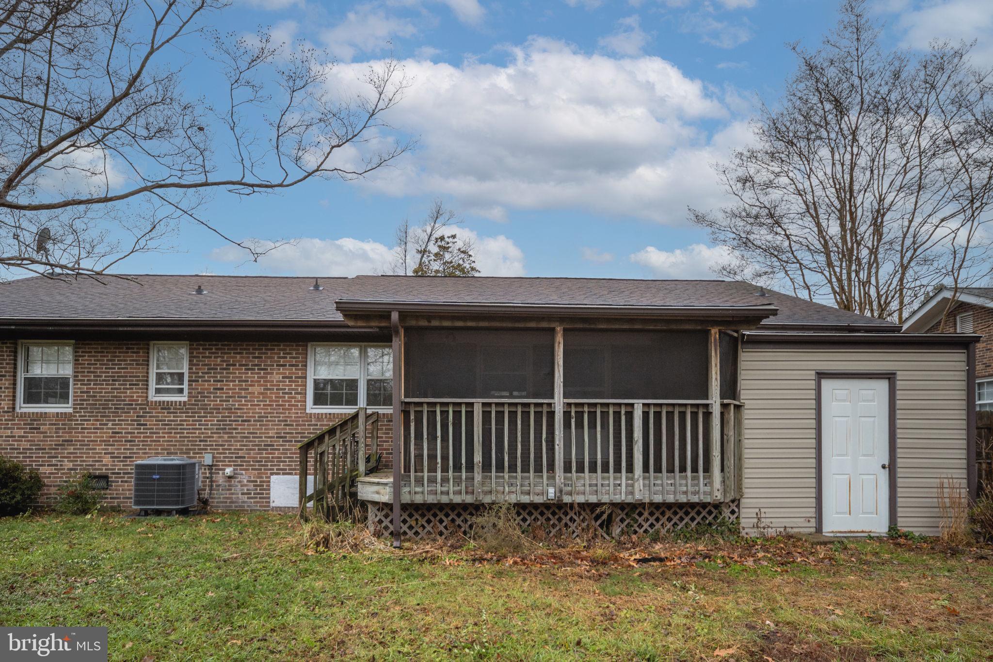 128 11th Street Colonial Beach, VA 22443 - Photo 47 of 58 a view of a house with a yard and a table