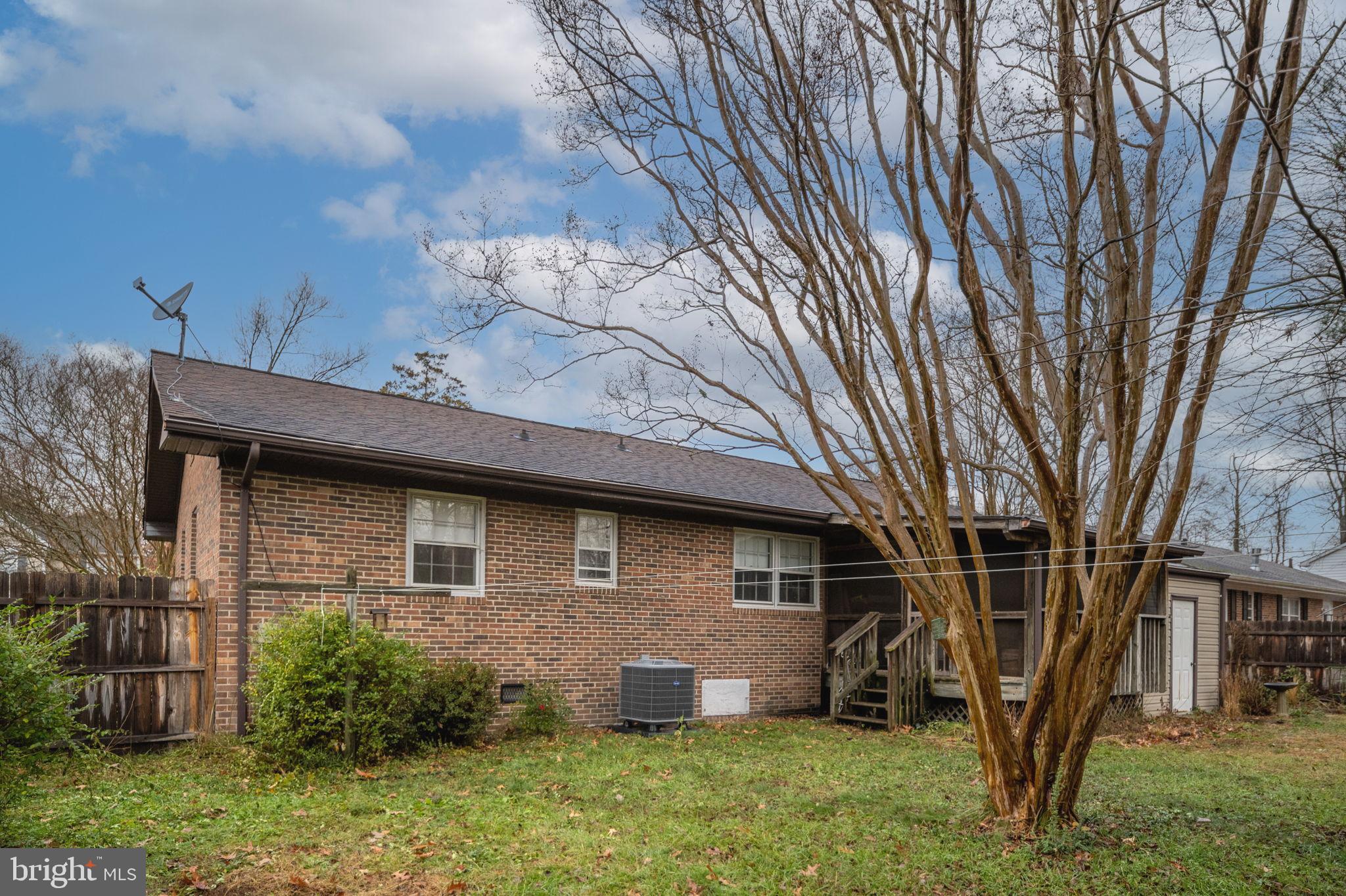 128 11th Street Colonial Beach, VA 22443 - Photo 48 of 58 a brick house with a large window