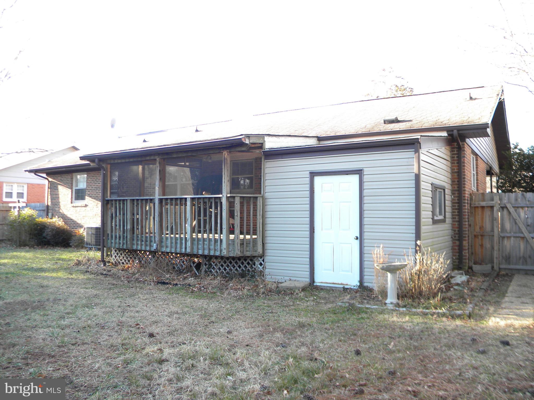 128 11th Street Colonial Beach, VA 22443 - Photo 56 of 80 a view of a house with a backyard and stairs