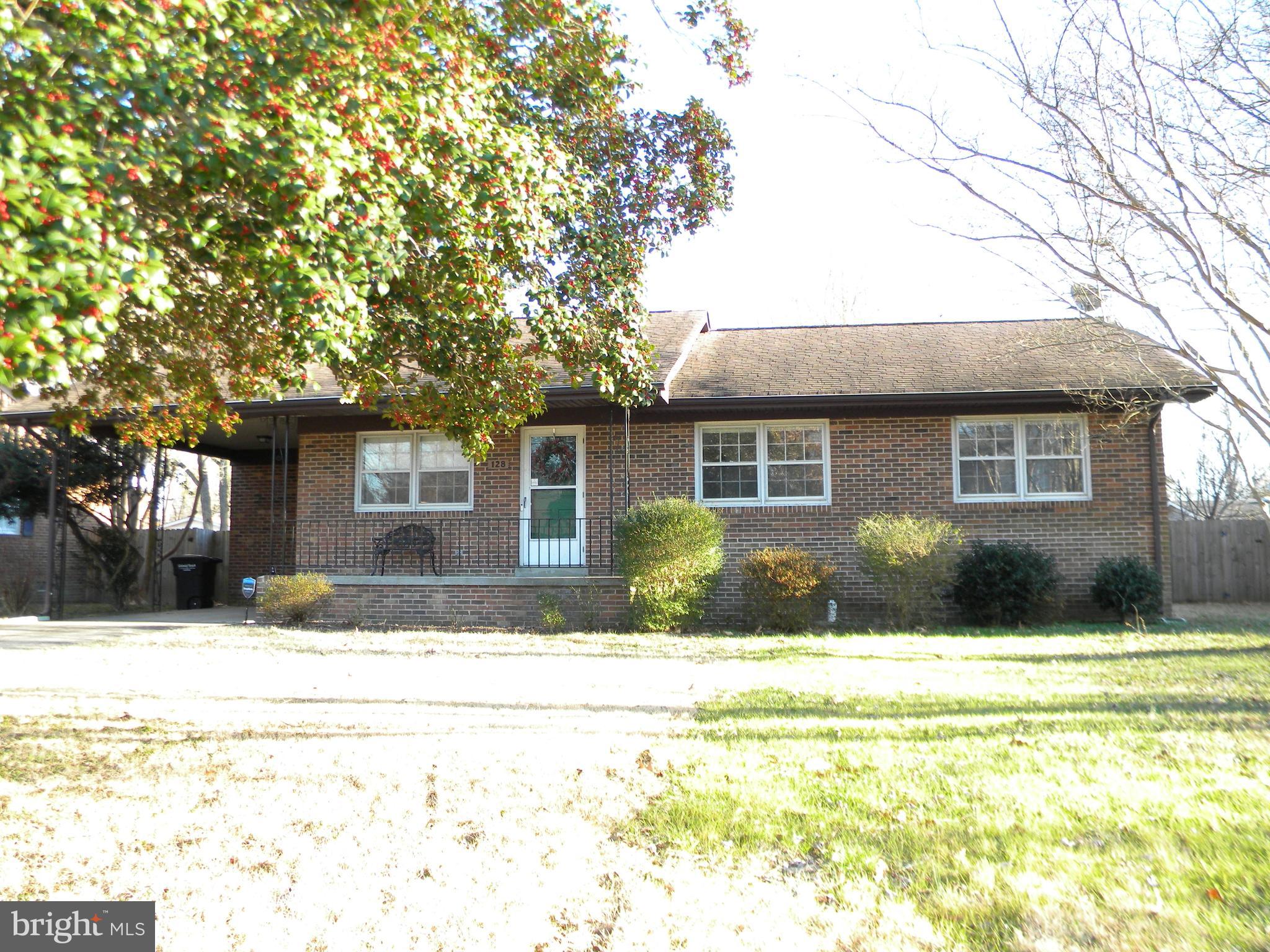 128 11th Street Colonial Beach, VA 22443 - Photo 63 of 80 a front view of a house with a yard