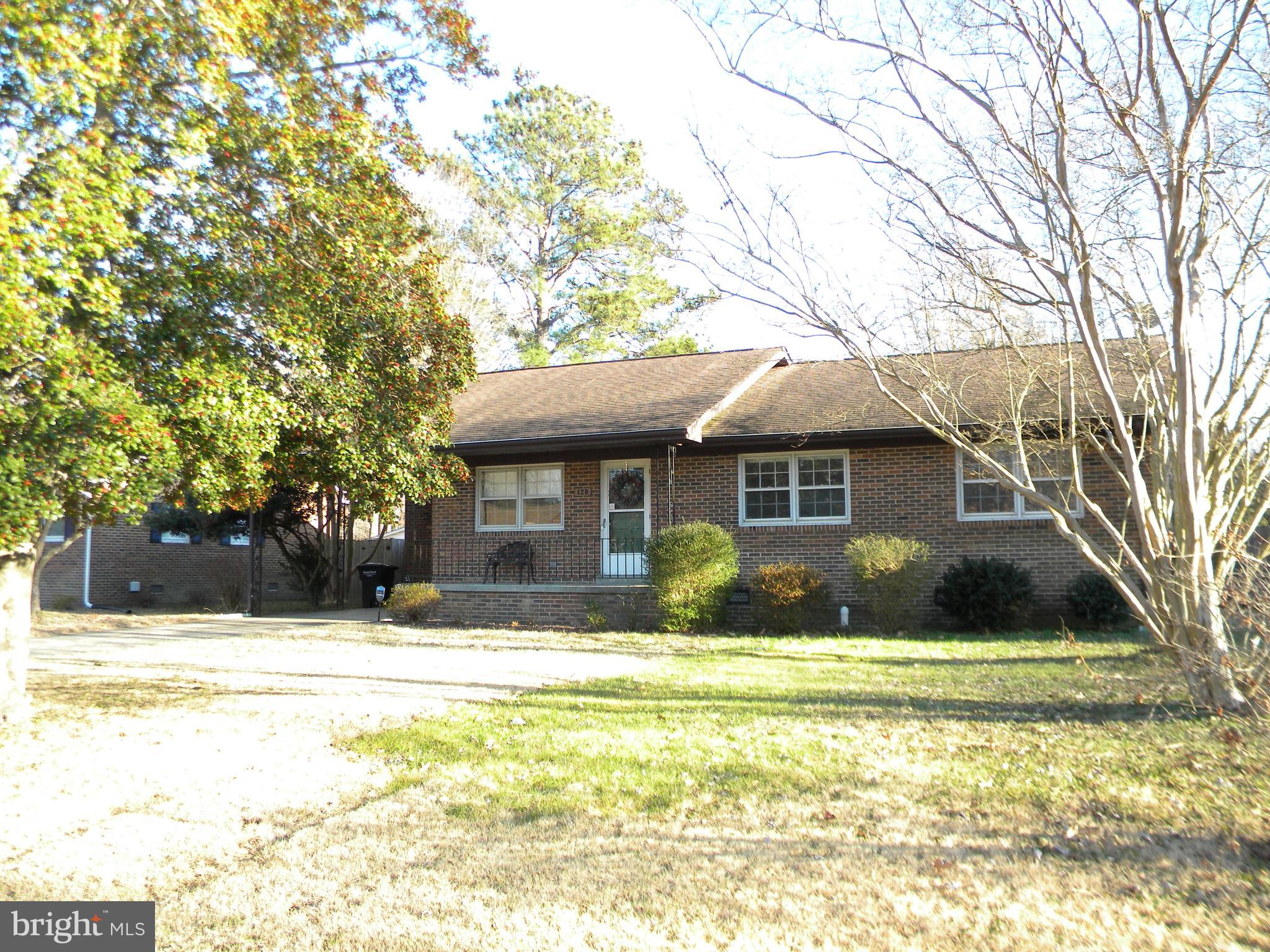 128 11th Street Colonial Beach, VA 22443 - Photo 71 of 80 a front view of a house with a yard