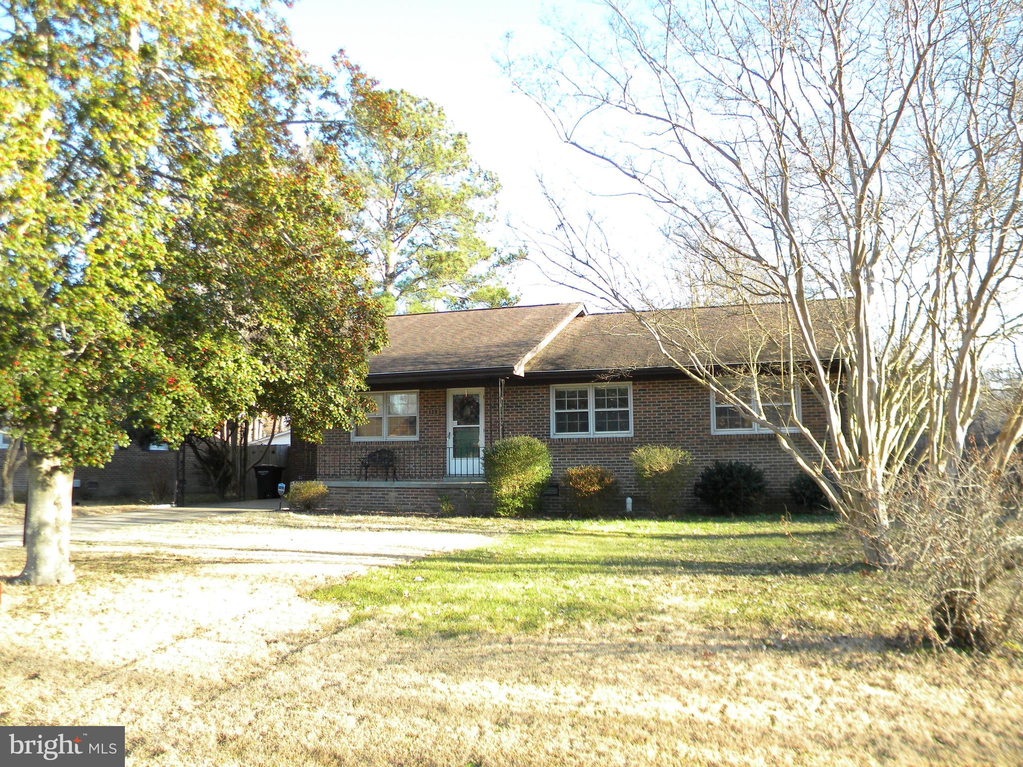 128 11th Street Colonial Beach, VA 22443 - Photo 72 of 80 a front view of a house with a yard