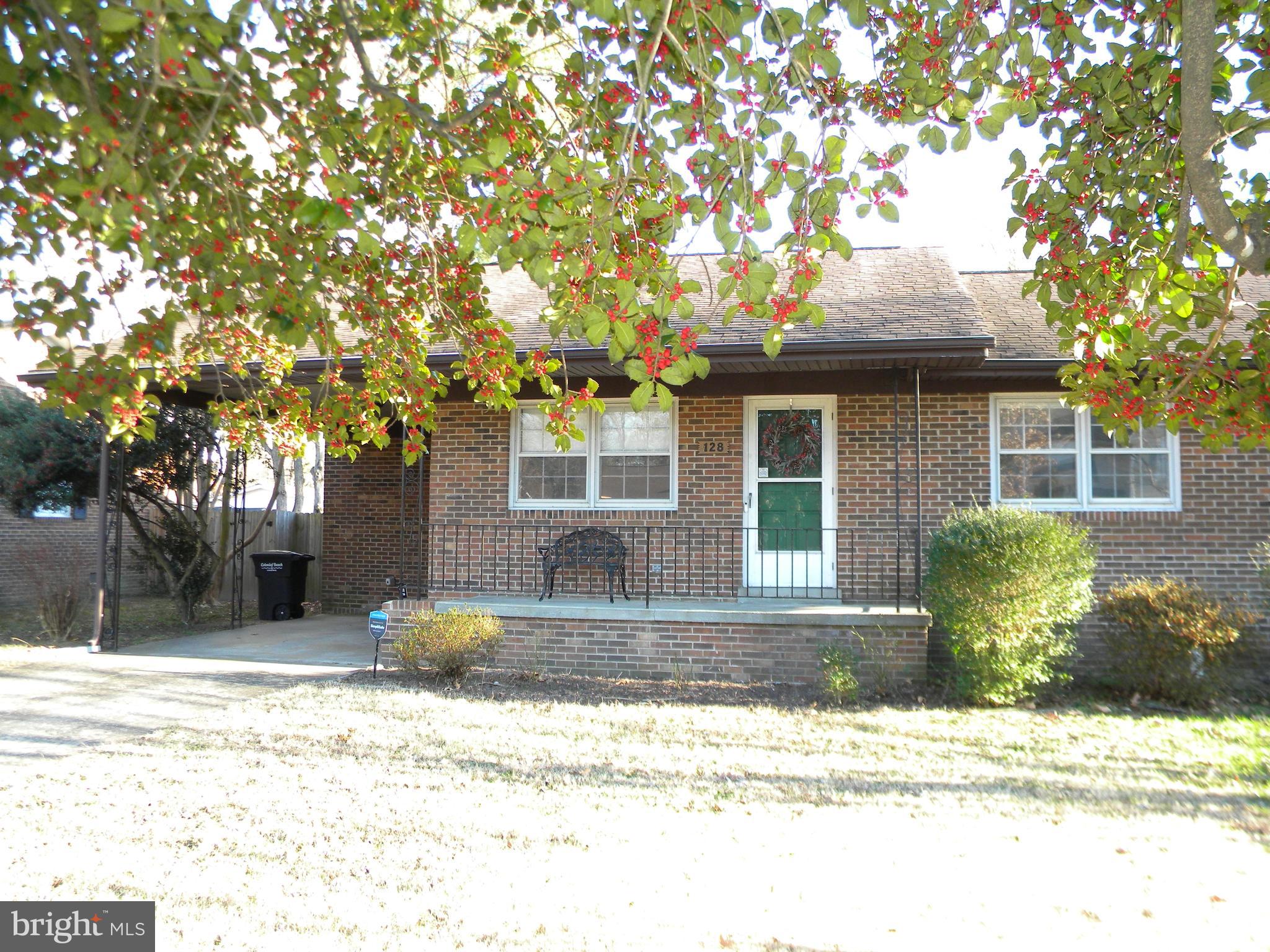 128 11th Street Colonial Beach, VA 22443 - Photo 74 of 80 a front view of a house with a yard