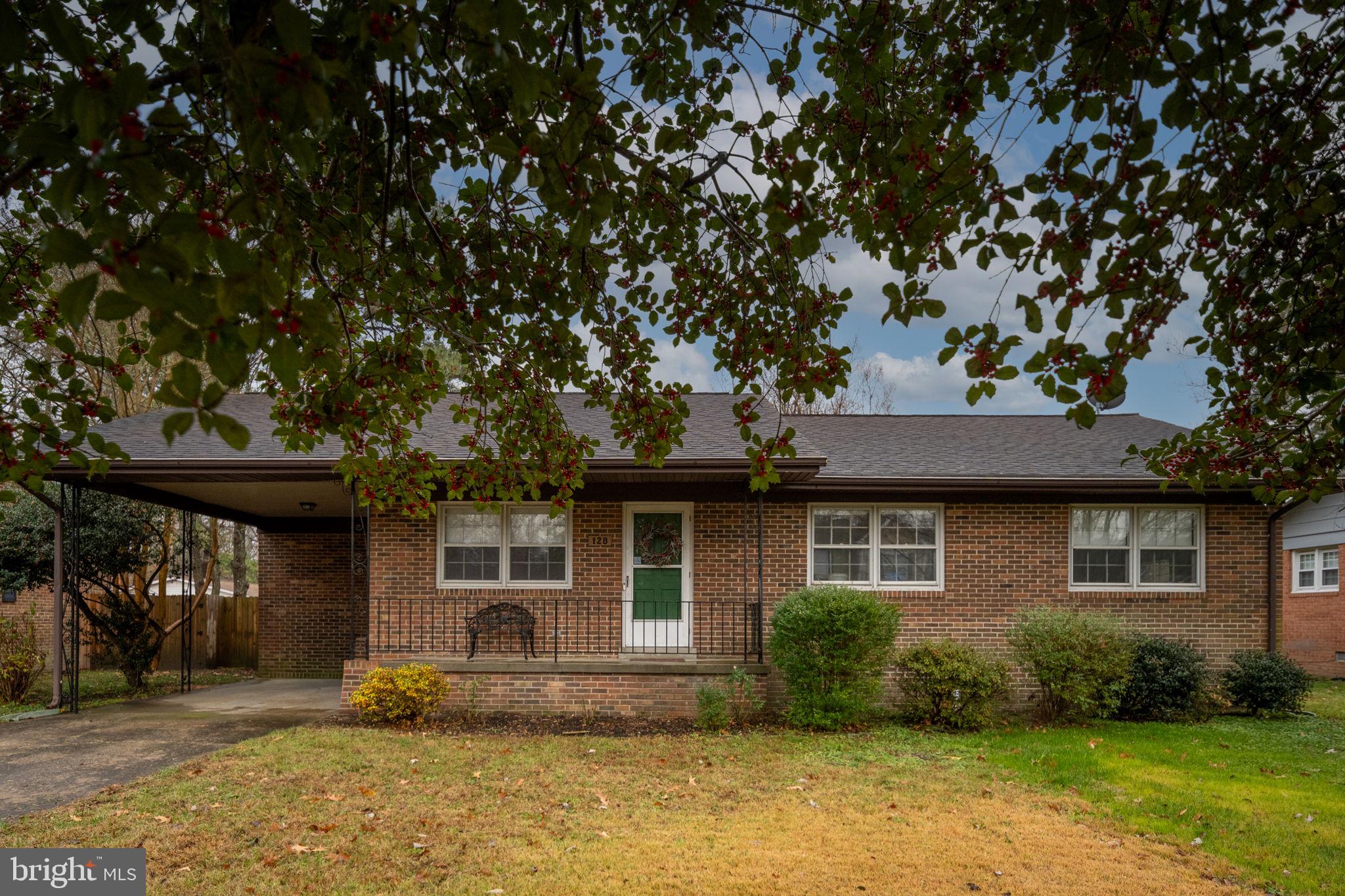 128 11th Street Colonial Beach, VA 22443 - Photo 8 of 80 a front view of a house with garden
