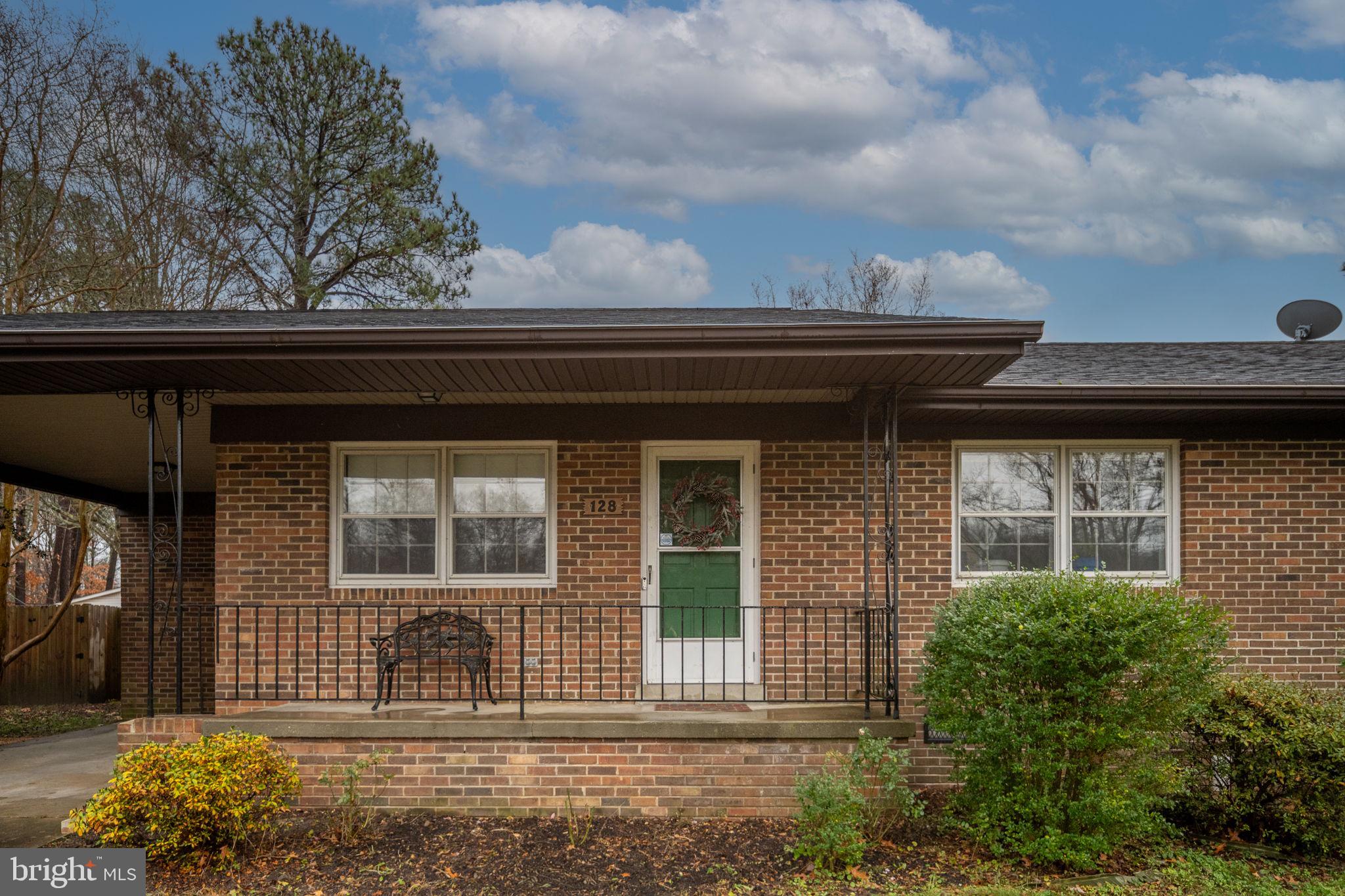 128 11th Street Colonial Beach, VA 22443 - Photo 10 of 58 a front view of a house with garden