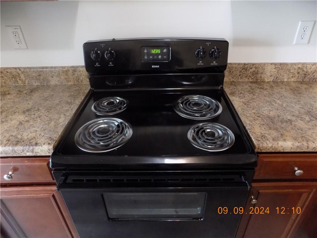 5509 Sable Way Atlanta, GA 30349 - Photo 11 of 37 a close up of a stove