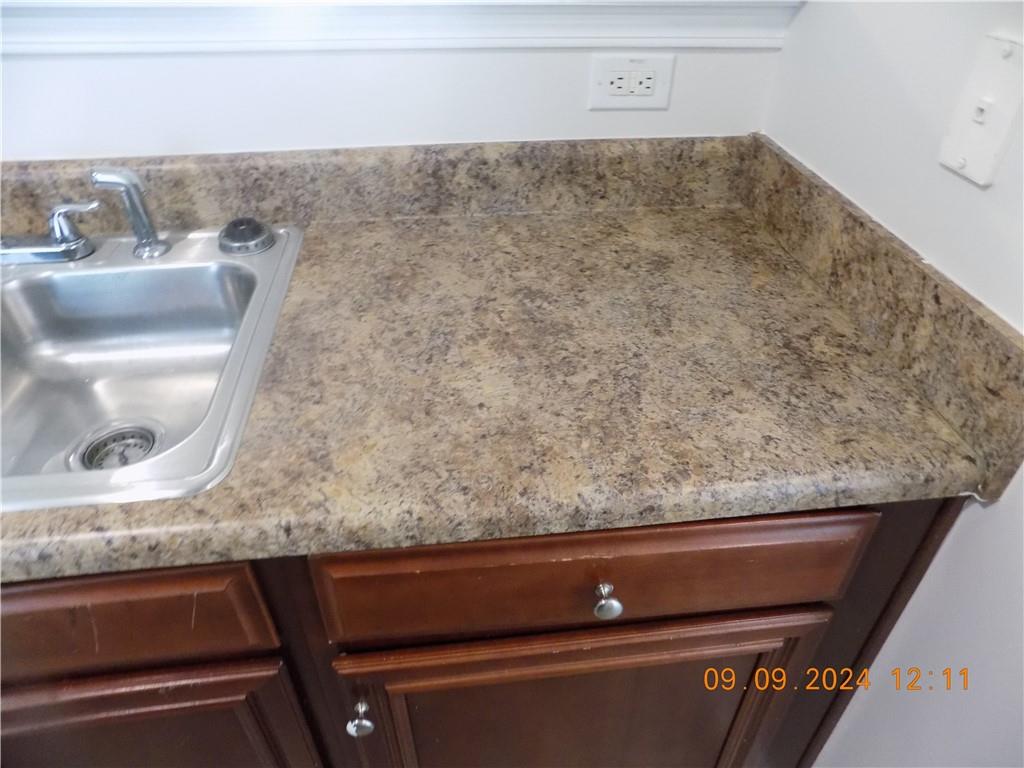 5509 Sable Way Atlanta, GA 30349 - Photo 15 of 37 a close view of sink and tap