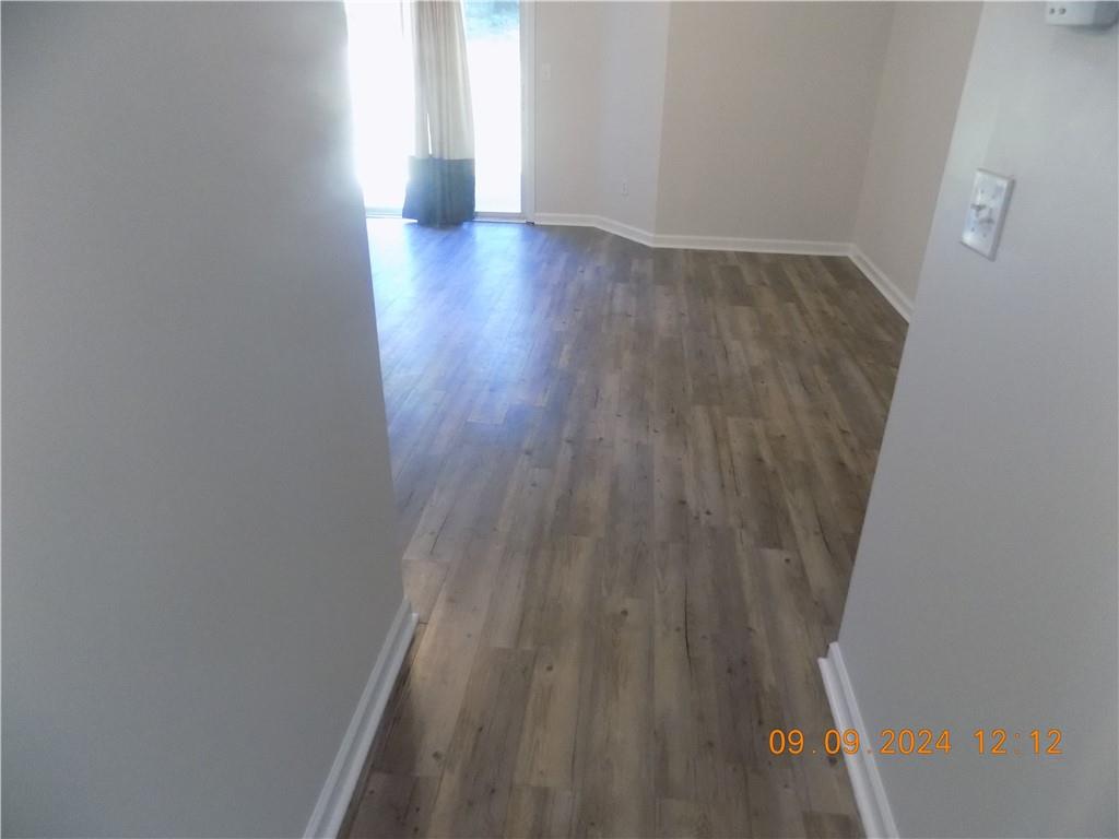 5509 Sable Way Atlanta, GA 30349 - Photo 19 of 37 a view of a hallway with wooden floor