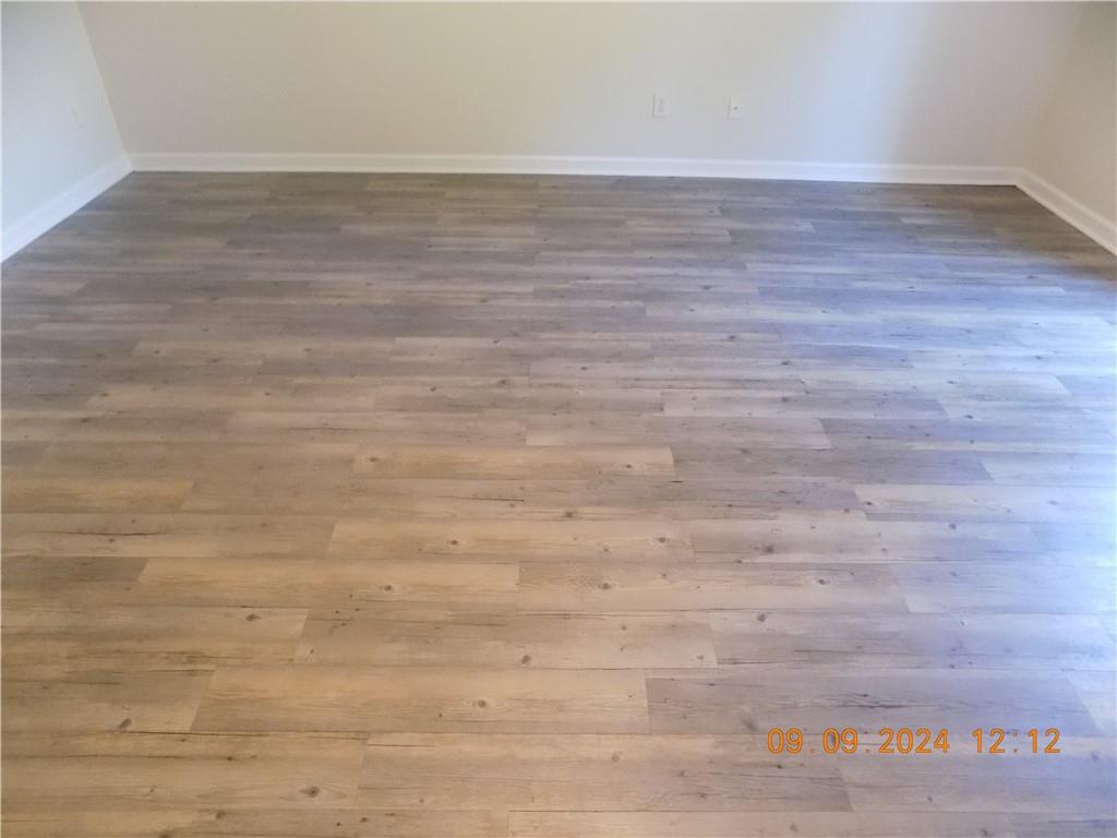 5509 Sable Way Atlanta, GA 30349 - Photo 20 of 37 a view of an empty room and wooden floor