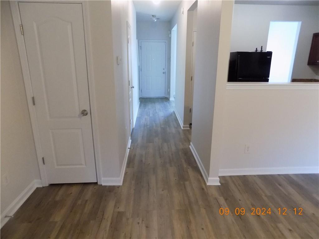 5509 Sable Way Atlanta, GA 30349 - Photo 22 of 37 a view of a hallway with wooden floor