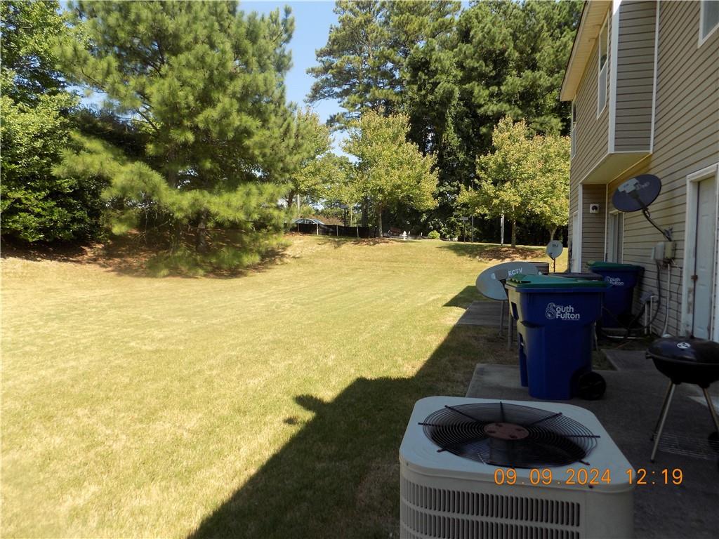 5509 Sable Way Atlanta, GA 30349 - Photo 37 of 37 a swimming pool with outdoor seating and yard