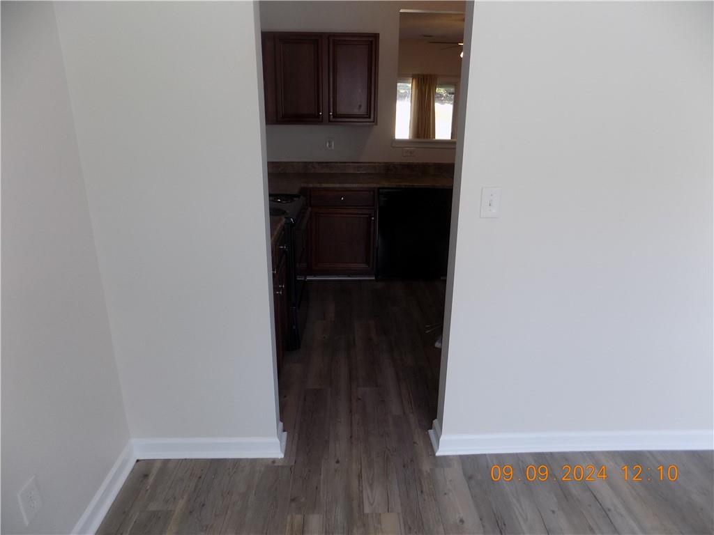 5509 Sable Way Atlanta, GA 30349 - Photo 7 of 37 a view of a hallway with wooden floor and staircase