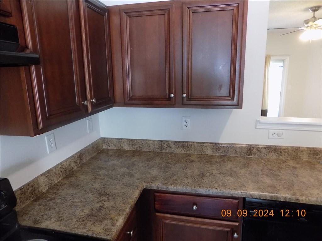 5509 Sable Way Atlanta, GA 30349 - Photo 10 of 37 a view of a kitchen with granite countertop cabinets and a counter top space