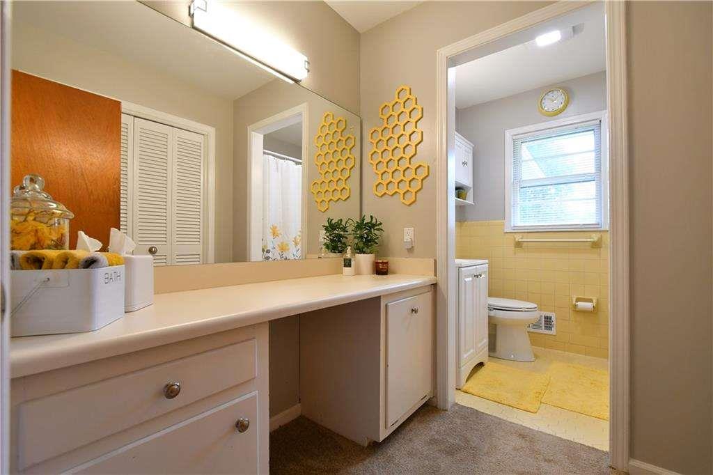 2877 Cartwright Drive Decatur, GA 30033 - Photo 12 of 19 a bathroom with a double vanity sink mirror and toilet