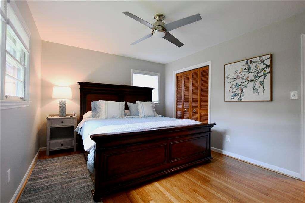 2877 Cartwright Drive Decatur, GA 30033 - Photo 16 of 19 a bedroom with a bed and wooden floor