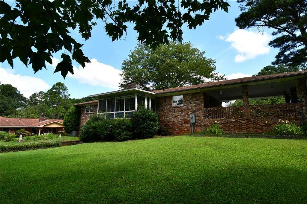 2877 Cartwright Drive Decatur, GA 30033 - Photo 18 of 19 a front view of a house with a yard