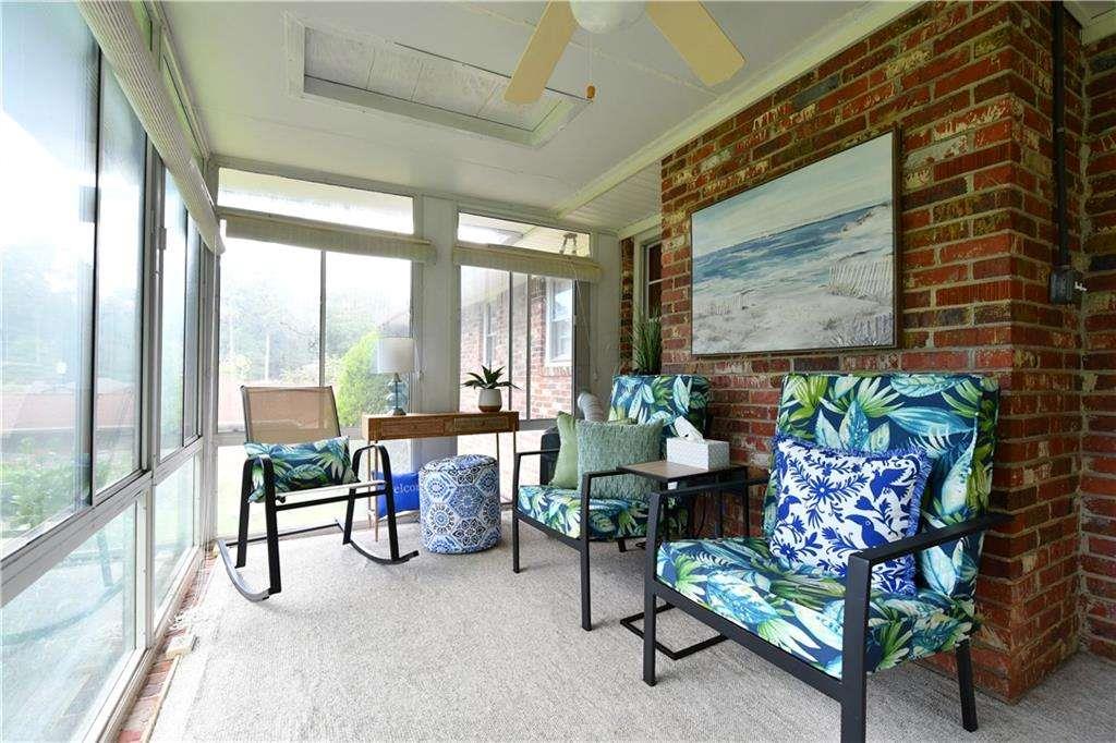 2877 Cartwright Drive Decatur, GA 30033 - Photo 7 of 19 a living room with furniture and a floor to ceiling window