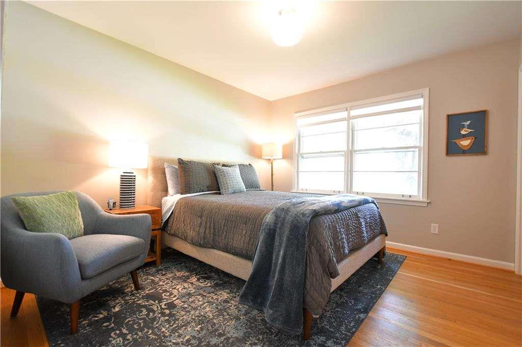 2877 Cartwright Drive Decatur, GA 30033 - Photo 9 of 19 a spacious bedroom with a bed and window