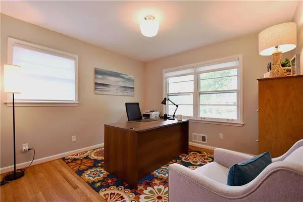 a work room with furniture and a window