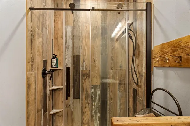 a view of a bathroom with shower and a sink