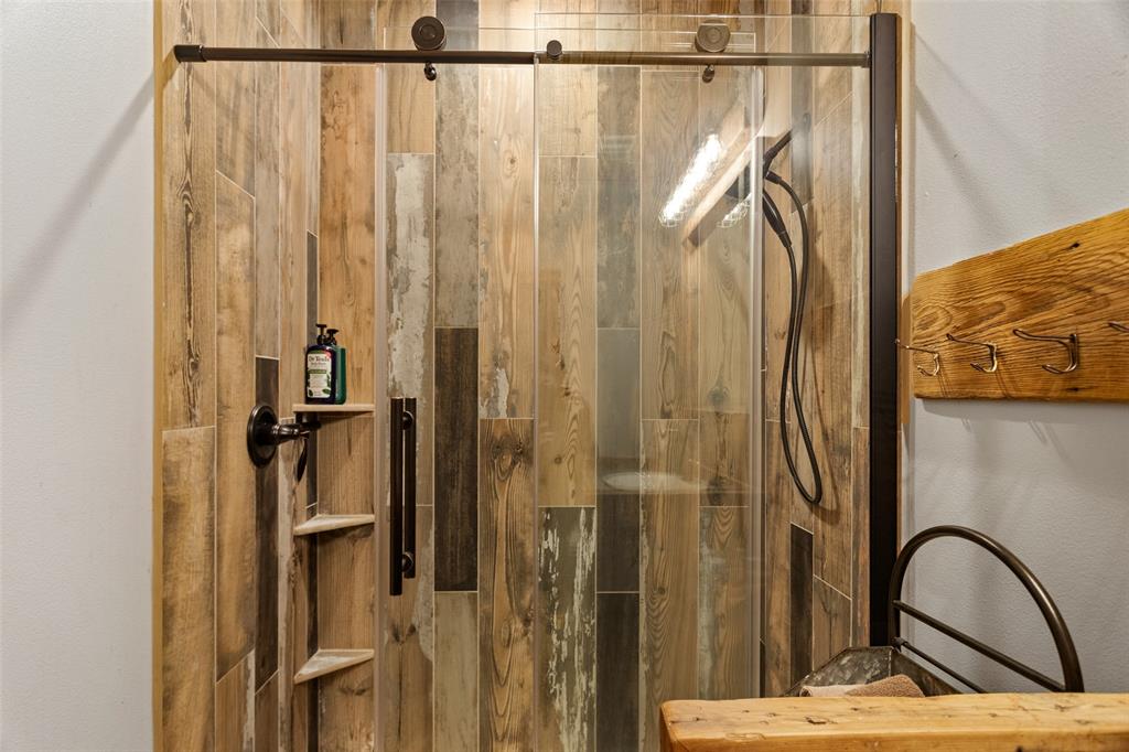 1016 Hells Gate Loop Strawn, TX 76475 - Photo 15 of 31 a view of a bathroom with shower and a sink