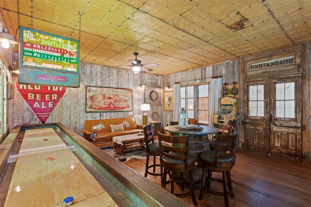 1016 Hells Gate Loop Strawn, TX 76475 - Photo 18 of 31 a view of a dining room with furniture a chandelier and wooden floor