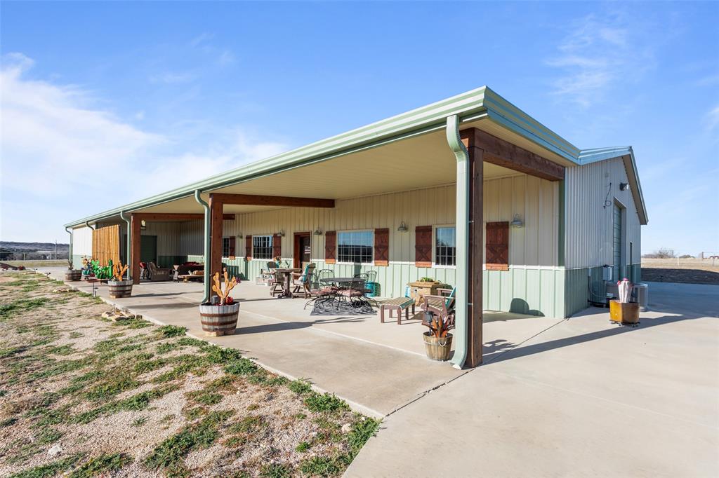 1016 Hells Gate Loop Strawn, TX 76475 - Photo 2 of 31 a view of a house with outdoor seating