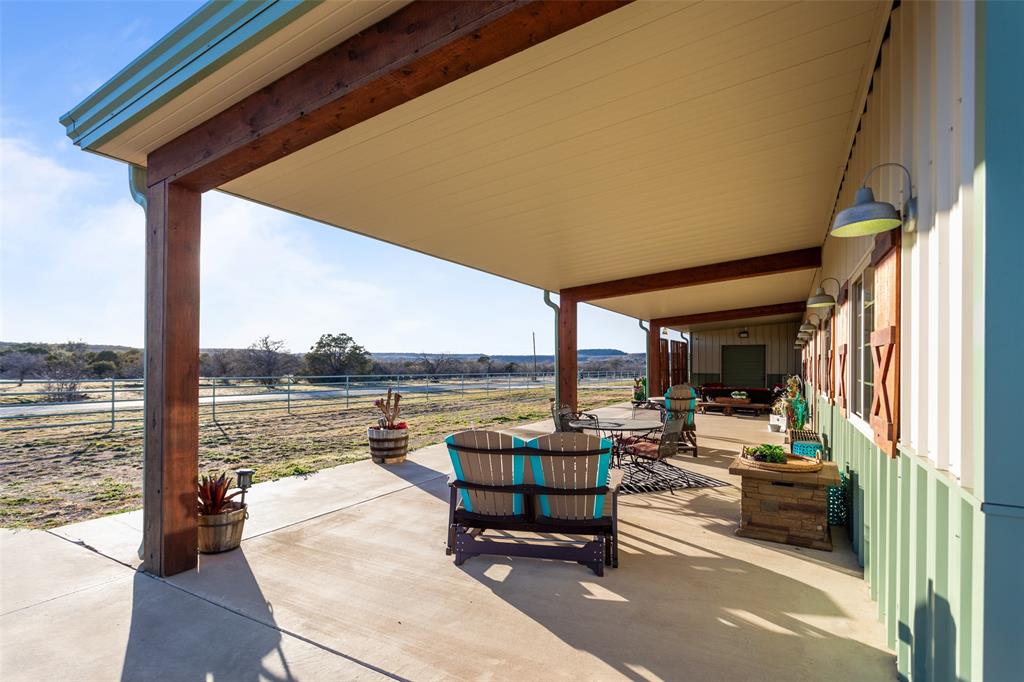 1016 Hells Gate Loop Strawn, TX 76475 - Photo 4 of 31 a house view with pool and outdoor seating