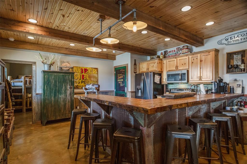 1016 Hells Gate Loop Strawn, TX 76475 - Photo 8 of 31 a dining table with chairs and window