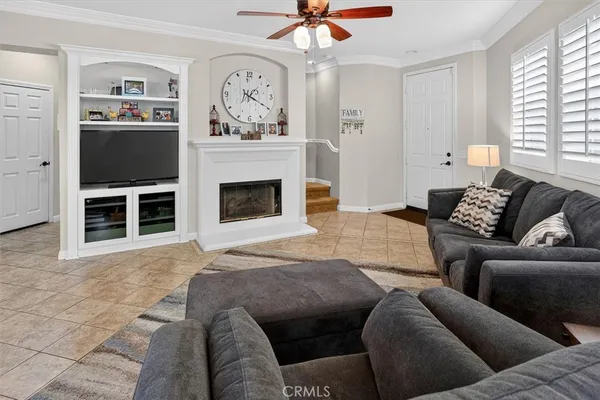 a bedroom with furniture and a fireplace
