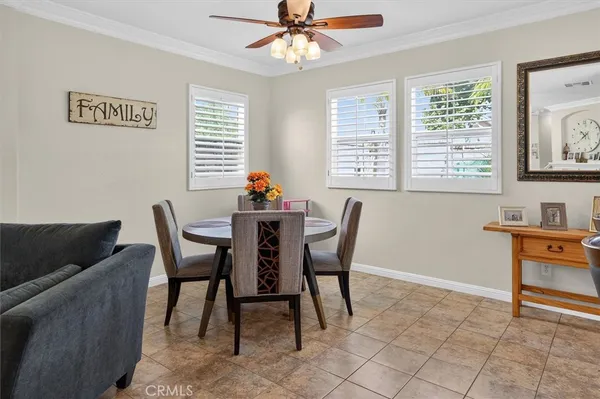 a dining room with furniture and window