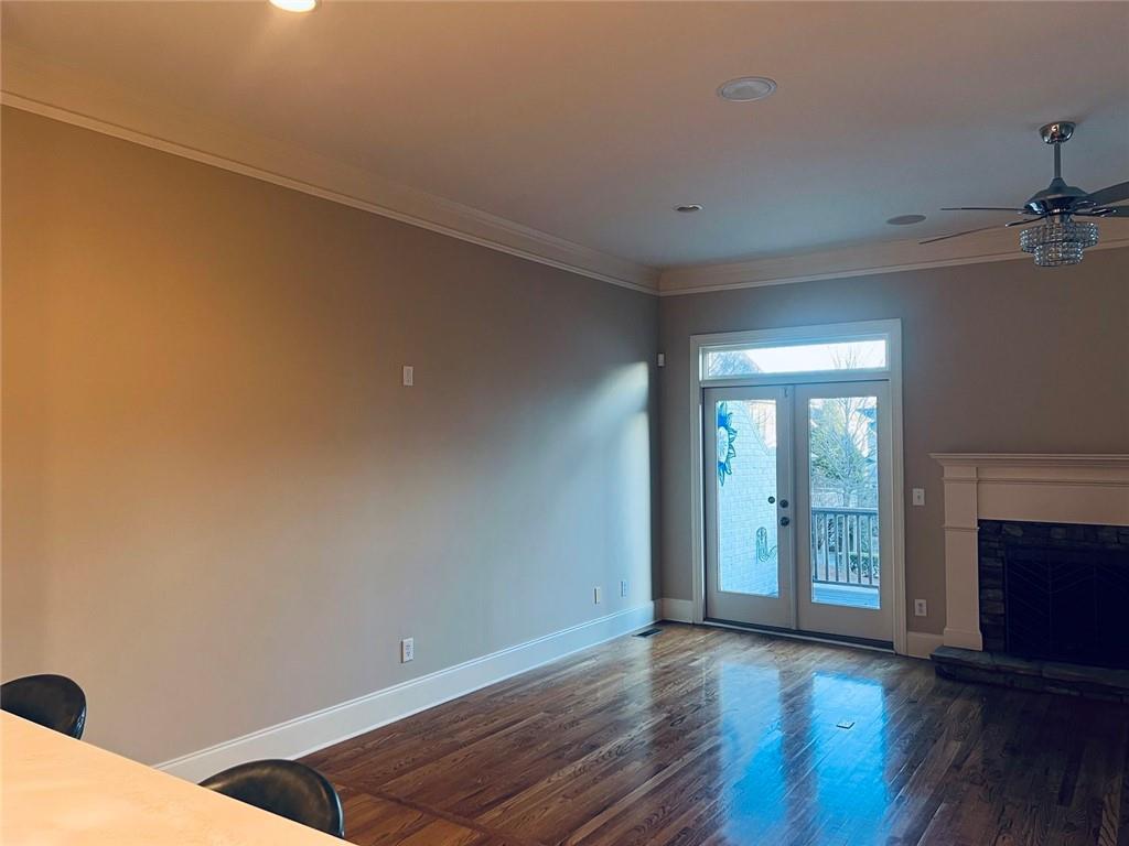 144 West Ridge Way Roswell, GA 30076 - Photo 11 of 30 a view of an empty room with wooden floor and a window