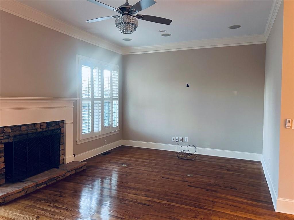 144 West Ridge Way Roswell, GA 30076 - Photo 13 of 30 a view of an empty room with wooden floor and a window